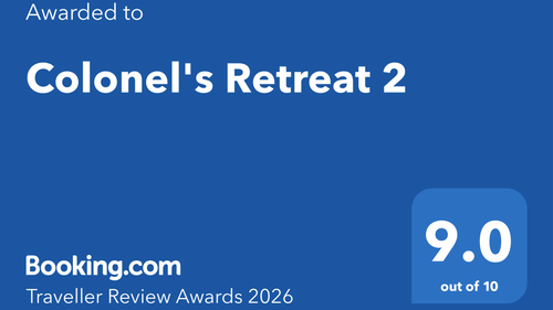 Award badge showcasing Colonel's Retreat 2 recognized in Booking.com Traveller Review Awards 2026 with a rating of 9.0 out of 10.