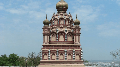 A place of worship with a flag hoisted on the arch.
