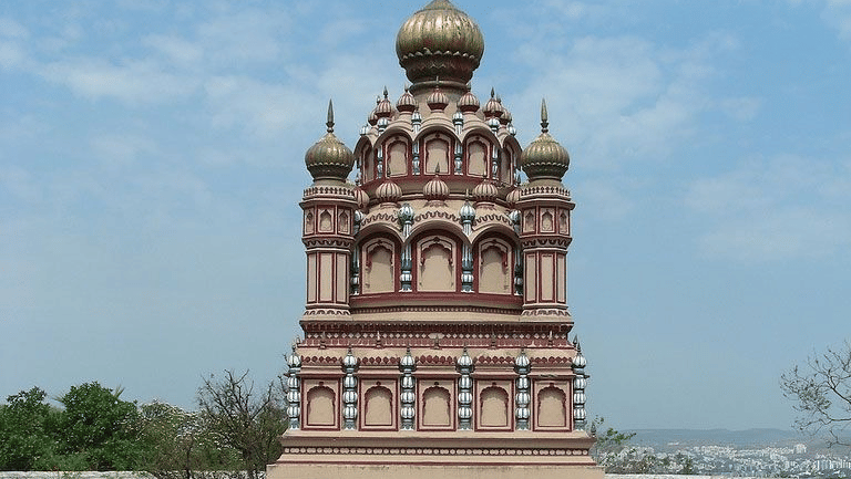 A place of worship with a flag hoisted on the arch.