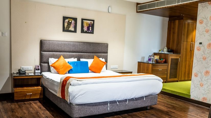 The Premier With Breakfast room at Kyriad Hotel in Gulbarga featuring a king size bed.