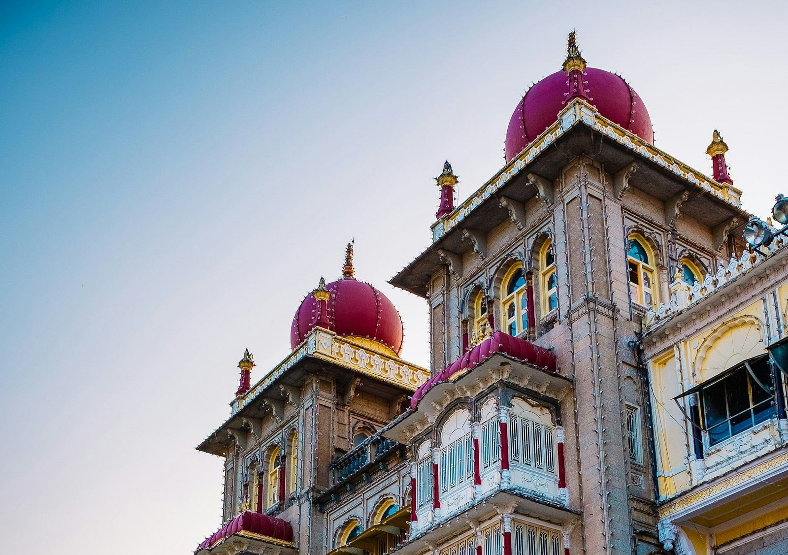 Exterior photograph of a palace with multiple domes and ornate details.
