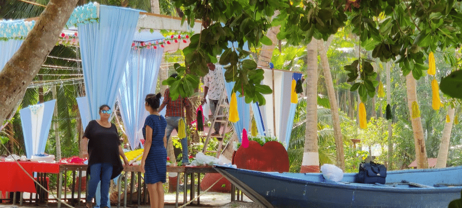 people standing next to the wedding stage