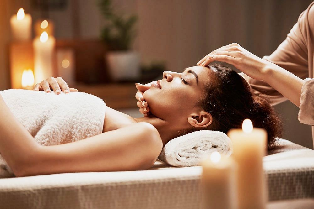 Shot of  a women experiencing  treatments at the spa | | The Grand Legacy Resort and Spa