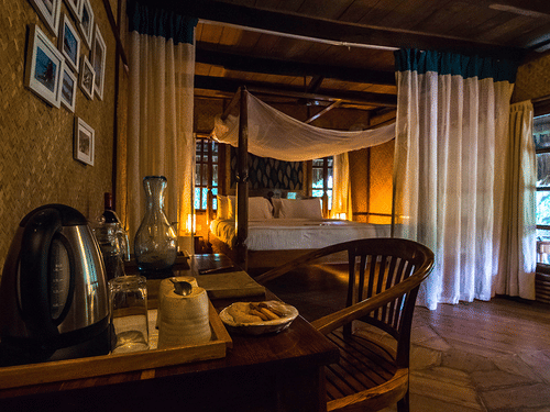 Table and chair in one of the fan-cooled Duplex Cottages at Barefoot at Havelock