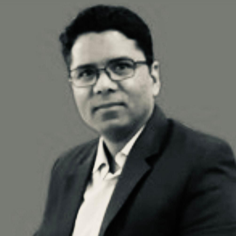 A portrait picture of Mr. Om Prakash Gwasikoti