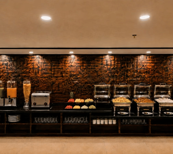 A wide view of the complete long buffet counter line arranged inside the dining area at Lime Tree Hotel & Banquet, Jaipur.