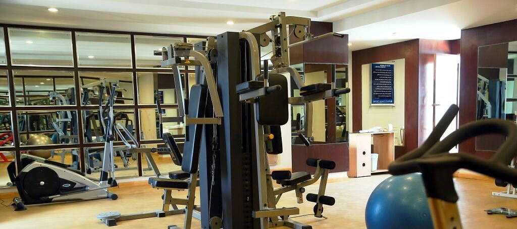 A gym filled with various equipment and bright lighting | Cenneys Gateway