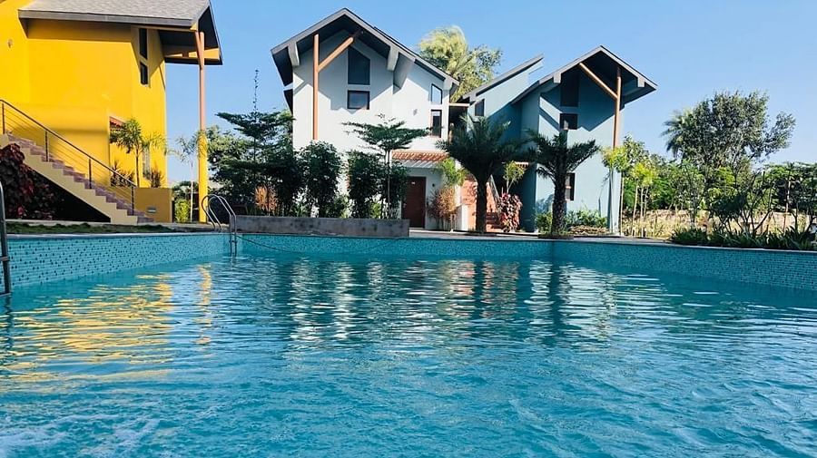 View of the poolside and the pool at Pride resort Ambaji