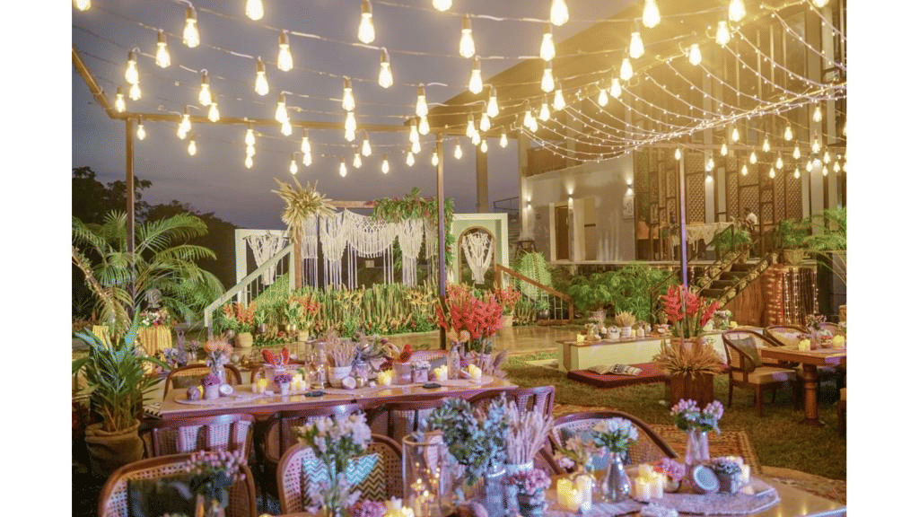 an outdoor event area all lit up with lights and decorated with flowers for an event at Symphony Samudra Beachside Jungle Resort And Spa, Port Blair