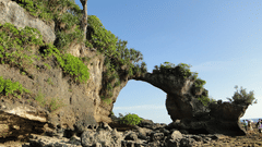 a rock formation with a empty circle in the centre in the andaman islands