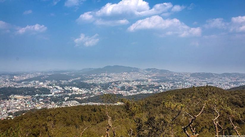 view of a peak that overlooks the city of shillong
