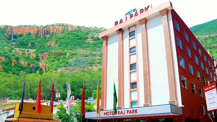 Facade of Raj Park Hotel, Tirupati with a mountain in the background