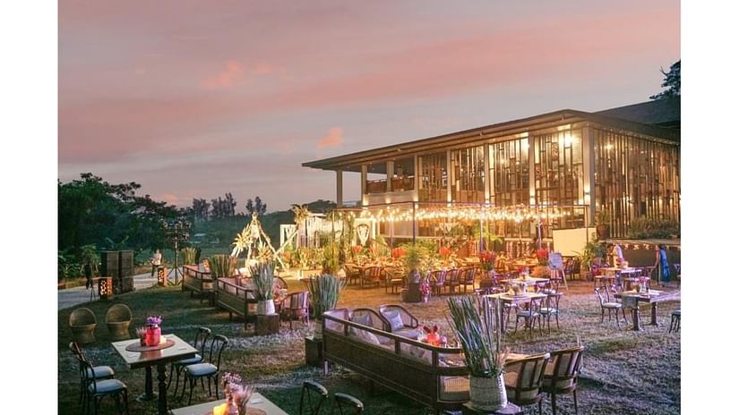 an outdoor event area all lit up with lights and decorated with flowers for an event at Symphony Samudra Beachside Jungle Resort And Spa, Port Blair
