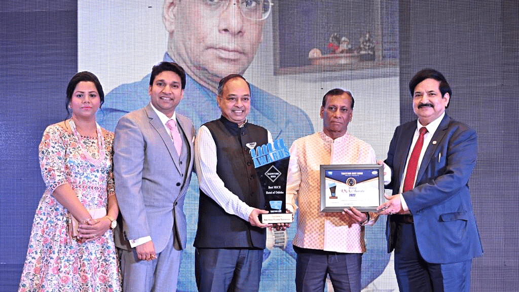 The Swosti Resorts team being awarded on stage at an event