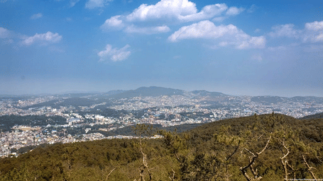 view of a peak that overlooks the city of shillong