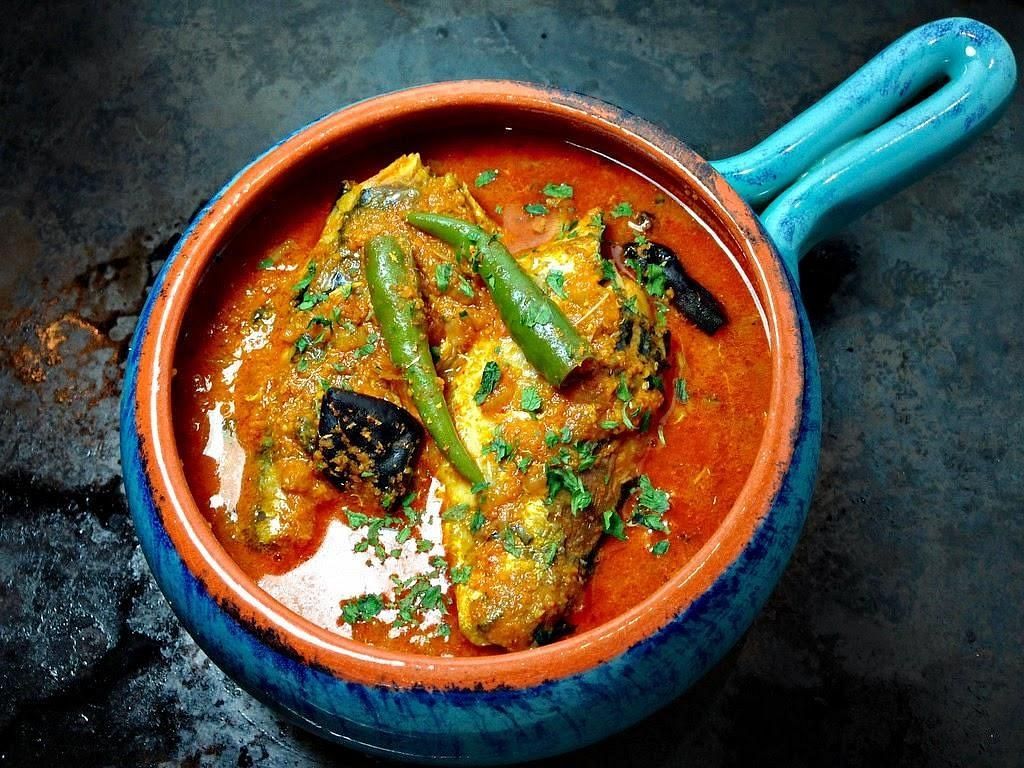 Traditional Goan fish curry served hot in a colourful bowl