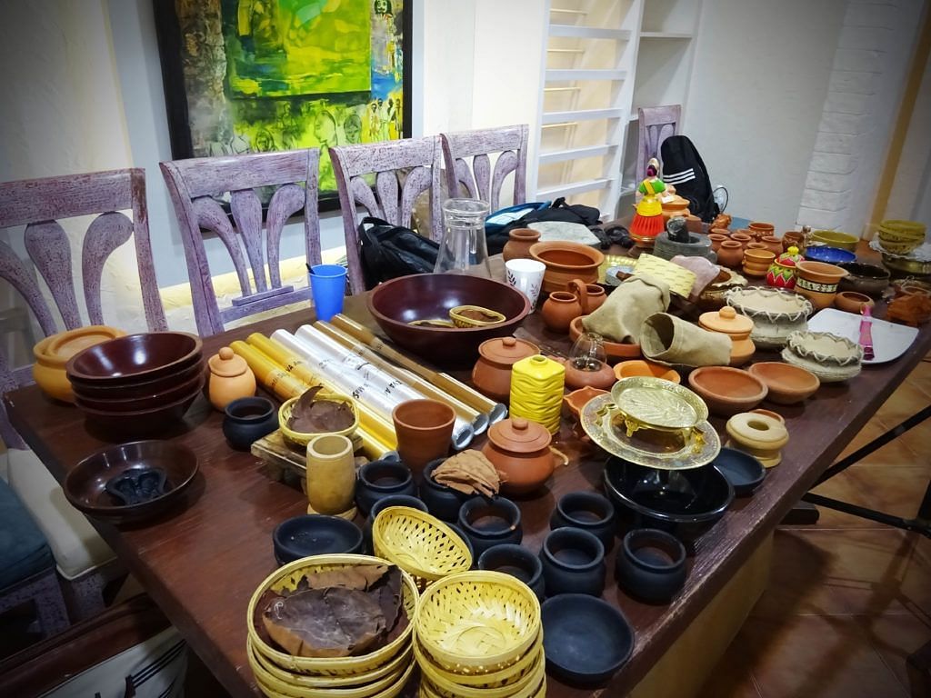 Dining table set with a variety of traditional dishes and utensils.