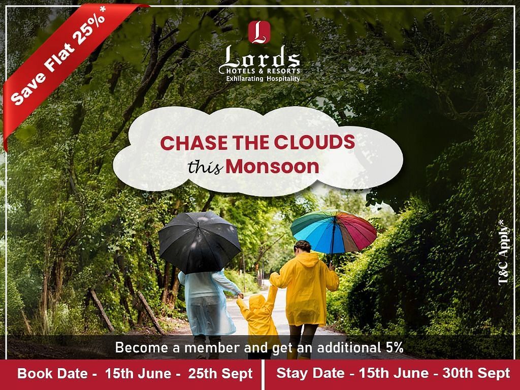 People with colorful umbrellas walk on a green forest path. Lords Hotels monsoon offer, save 25%, book by Sept 25, stay till Sept 30.
