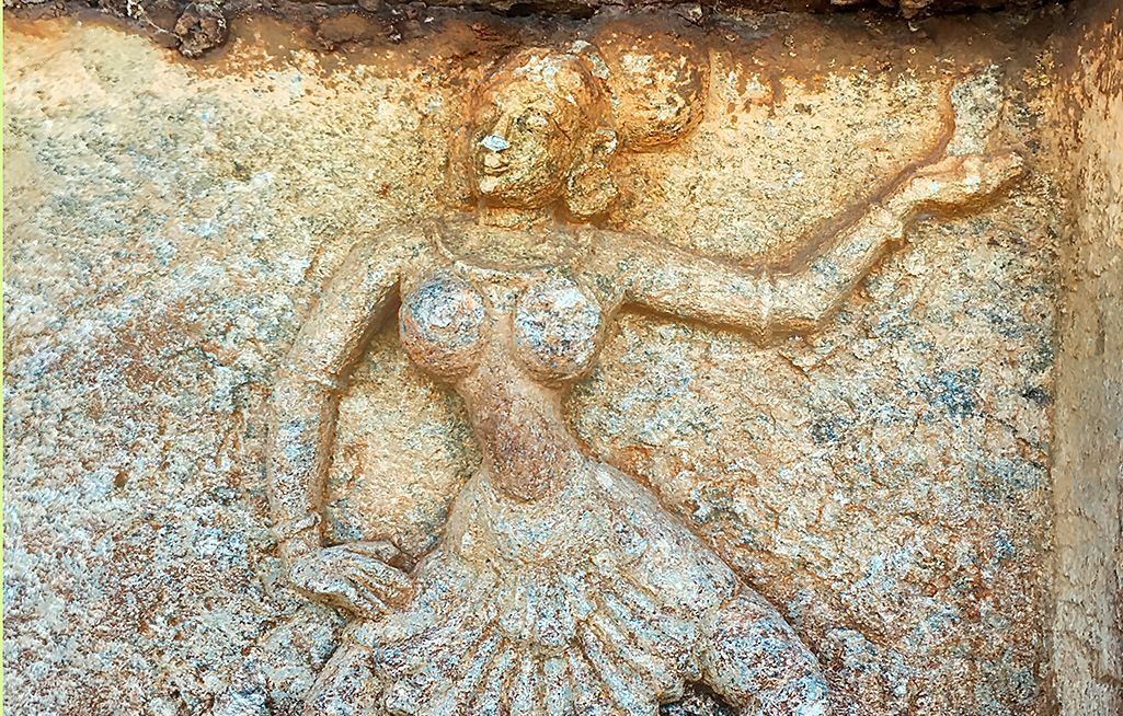 Hampi stone bas-relief of dancing women on a wall