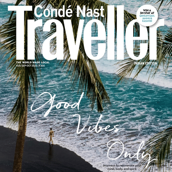 Conde Nast Traveller India magazine cover showing a coastal scene with palm trees and turquoise waters, titled - Good Vibes Only.