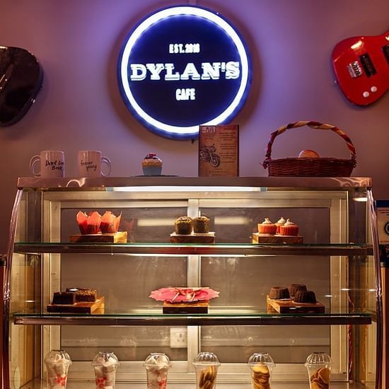 A display counter at Dylan's cafe featuring various pastries and cookies