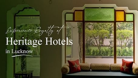 Experience Royalty at Heritage Hotels in Lucknow featuring an elegant indoor seating area adorned with traditional stained glass windows.
