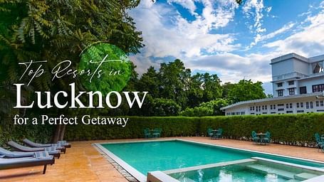 Top Resorts in Lucknow for a Perfect Getaway showcasing a serene poolside setting with classic white resort architecture in the background.