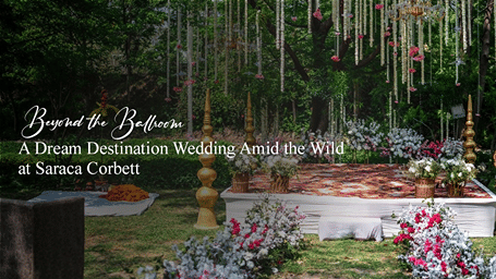 A destination wedding setup at Saraca Corbett surrounded by lush greenery, floral décor, chandeliers and elegant outdoor seating.