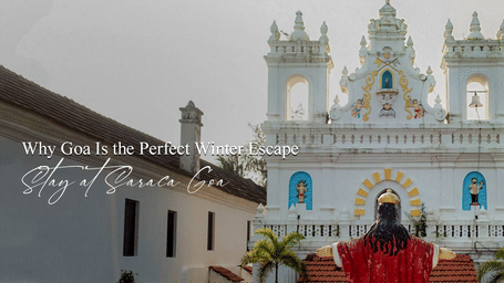 White historic church with ornate architecture, towers, and crosses, viewed from the courtyard.