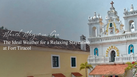 White and blue heritage church in Goa under clear skies near Fort Tiracol.
