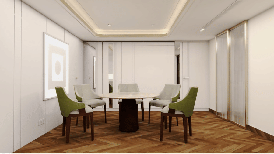 Meeting room with table and chairs for sitting at Hablis Hotel, Chennai.