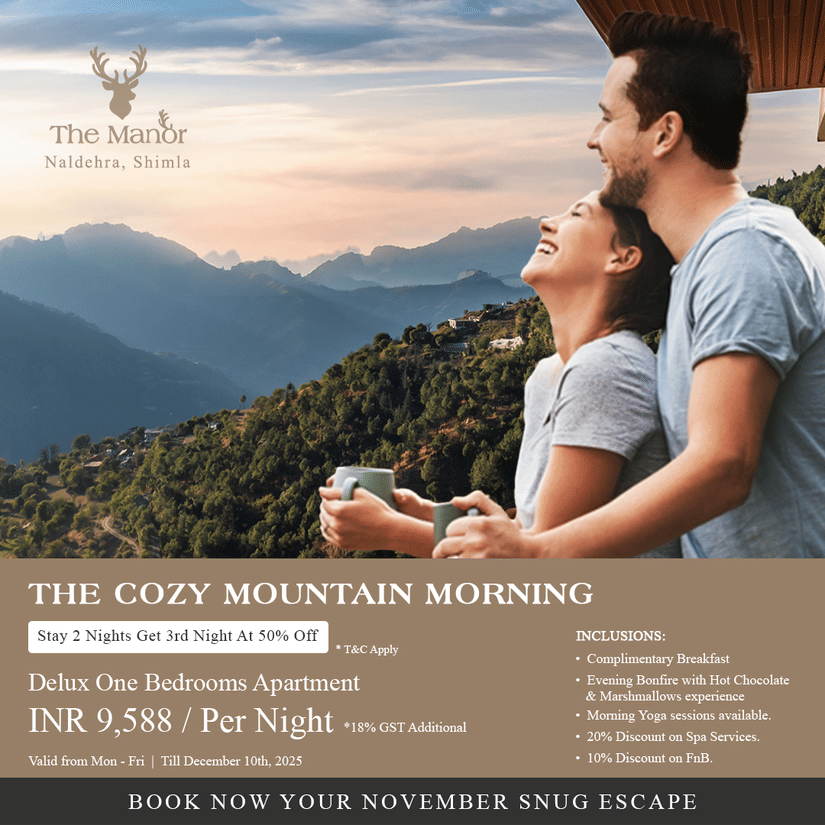 Couple enjoying mountain view from balcony at The Manor, Naldehra, Shimla.