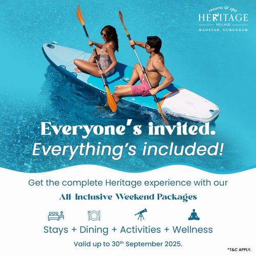 Promotional graphic showing two people on a kayak with text promoting the All-Inclusive Wellness Package at Heritage Village Resorts & Spa, Manesar.