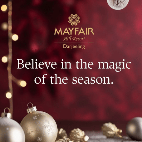A creative which says believe in the magic of the season at MAYFAIR Hill Resort, Darjeeling and also featuring decorative balls of Christmas.