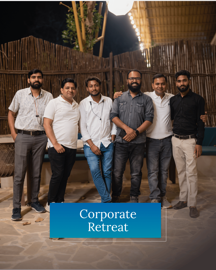 A corporate group photographed together on the resort's lit terrace at night, captioned Corporate Retreat
