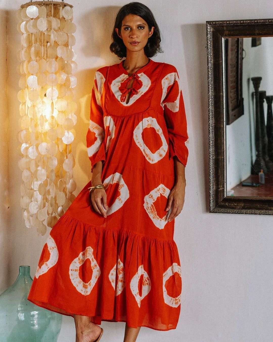 a model posing in a designer dress