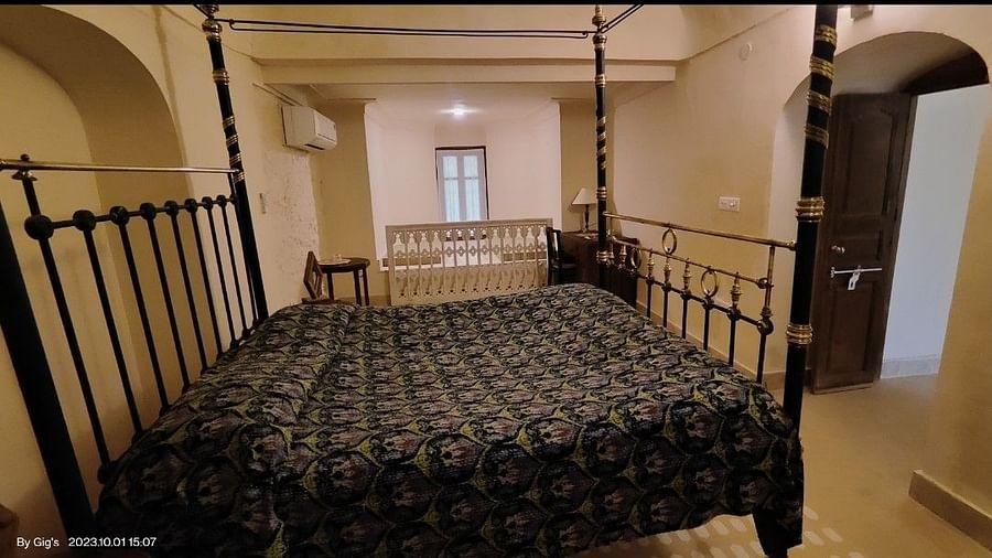 Room with a four poster bed and patterned bedding - Tijara Fort-Palace - 19th Century, Alwar.