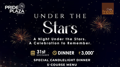 A promotional banner of Under the Stars event at Pride Plaza Ahemdabad featuring an outdoor celebration featuring a dark night sky with fireworks above a festive courtyard illuminated by fairy lights and decorated banquet tables.