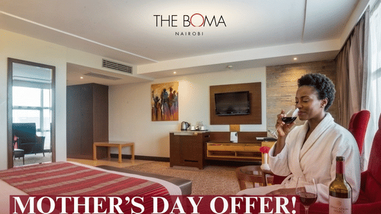 Woman in a robe enjoys a glass of red wine in a hotel room, promoting a Mother Day Offer at The Boma Nairobi. Includes benefits like bed and breakfast, access to amenities, with a price of Ksh 18,000. Valid from May 8 to May 11, 2026.
