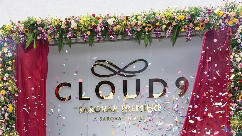 An image of a white board decorated with red fabric where Cloud 9 is written - Cloud9 Sarovar Premiere, Palolem Goa