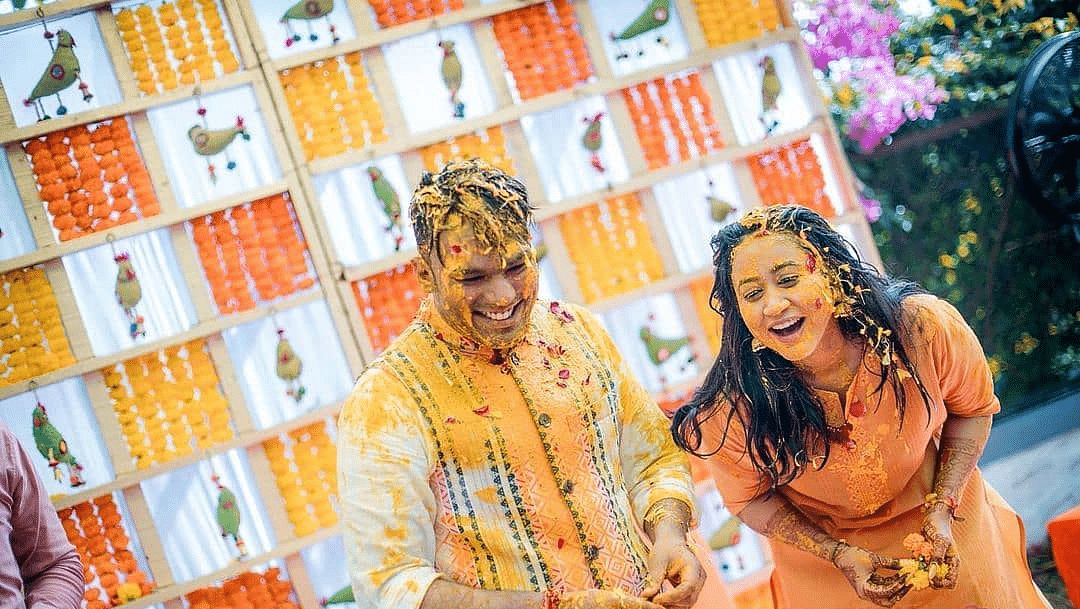 The couple drips in haldi during the Haldi celebrations - Rhythm Lonavala