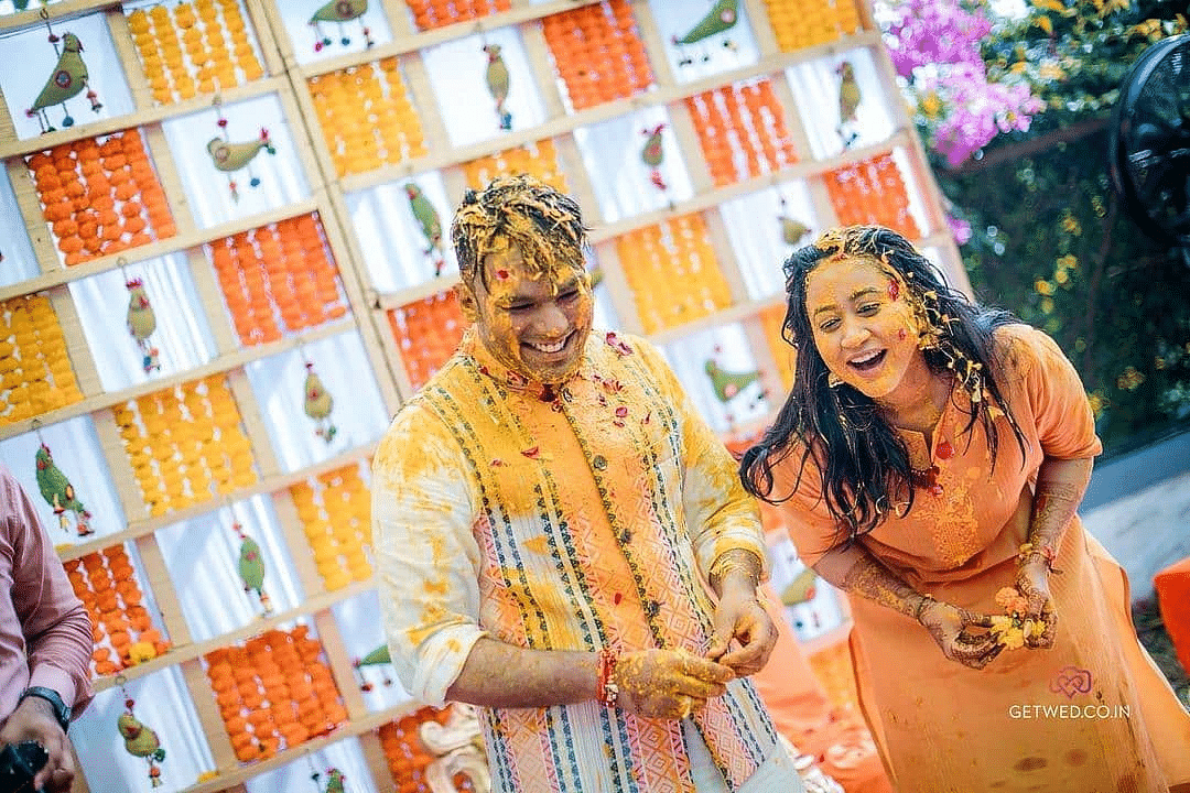 The couple drips in haldi during the Haldi celebrations - Rhythm Lonavala