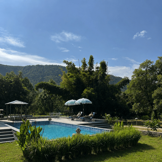 Sunny Poolside Retreat with Mountain Views-Surya Bagh