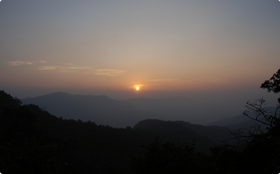 An image of a sunset in the hills