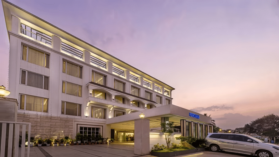 Facade of a hotel during sunrise