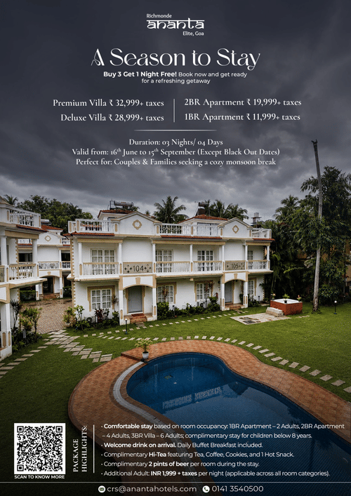 A premium white villa property with a beautiful curved swimming pool and lush green lawns under a cloudy sky, promoting a monsoon stay in Goa.