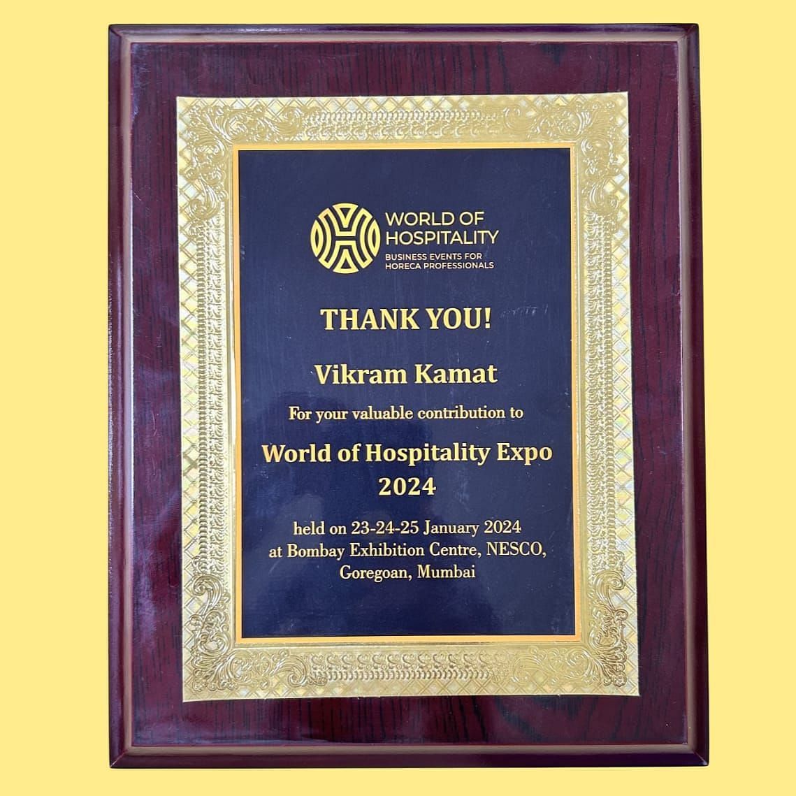 An image of an accolade presented to Vikram Kamat for his invaluable contribution to World of Hospitality Expo 2024 - Kamats India