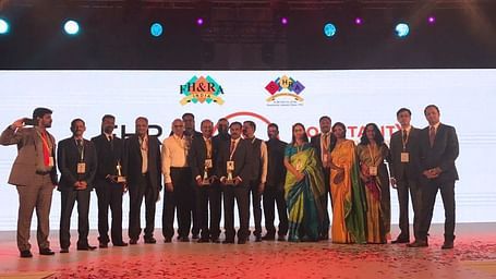 The team posing for a photo after receiving awards at FHRAI1