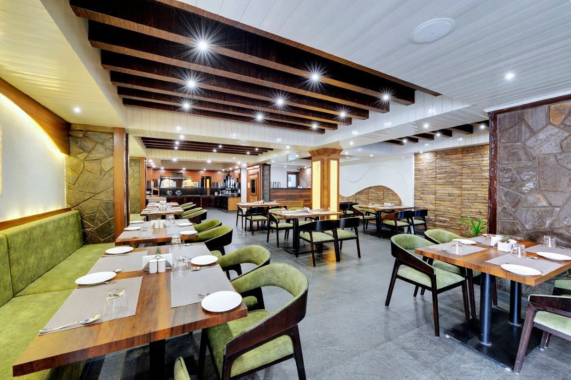 An image of Sumitel Queensyard restaurant with seating arrangements