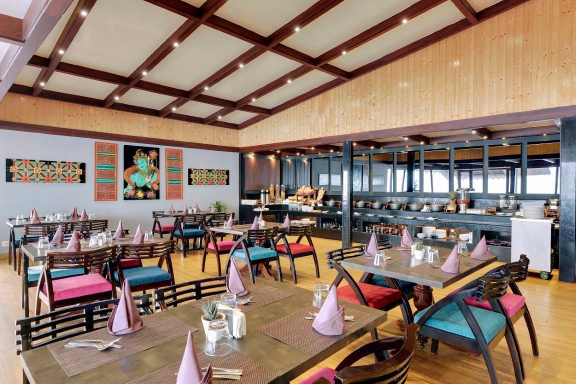 An image of the blue charcoal restaurant with seating arrangement - Sumitel Vista TV Tower